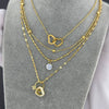 "Necklace with a heart-shaped cubic zirconia pendant and gold-plated chain."