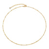 Minimalist gold-plated necklace displayed flat alongside matching earrings.