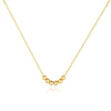 Gold-plated necklace with a delicate cubic zirconia pendant on a white background.