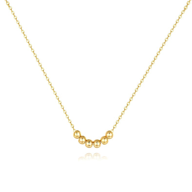 Gold-plated necklace with a delicate cubic zirconia pendant on a white background.