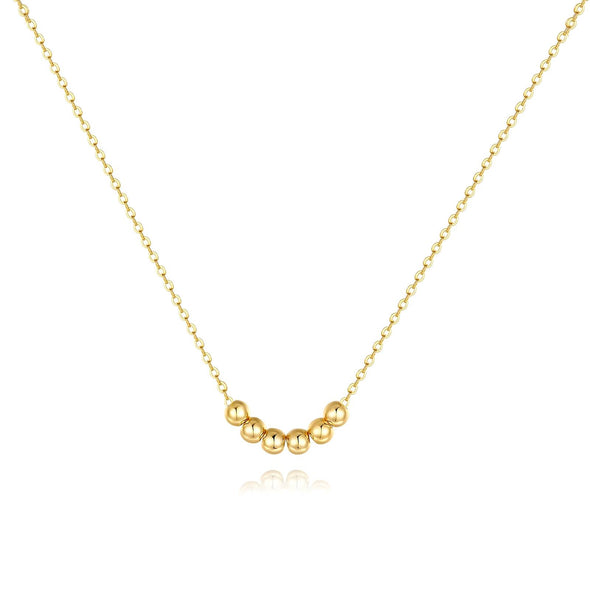 Gold-plated necklace with a delicate cubic zirconia pendant on a white background.