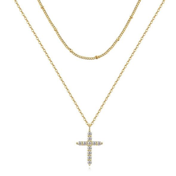 Flat lay of a gold-plated necklace with cubic zirconia and other matching jewelry pieces.