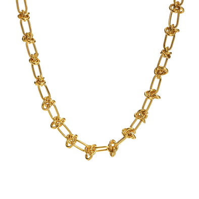 Layered gold-plated necklaces styled for a trendy bohemian look.