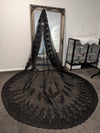 Dramatic long black cathedral-length wedding veil, ideal for unique and alternative bridal styles