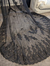 Close-up of intricate lace detailing on the Gisel black cathedral wedding veil