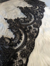 Close-up of intricate lace detailing on the Gisel black cathedral wedding veil